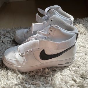 White and black high top Air Force ones